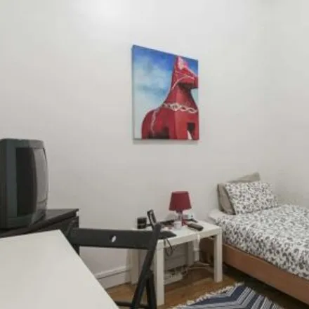 Rent this 4 bed room on Rua António Pereira Carrilho 7 in 1000-047 Lisbon, Portugal