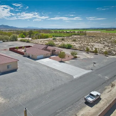 Buy this 4 bed house on 1901 Ming Tree Lane in Pahrump, NV 89060