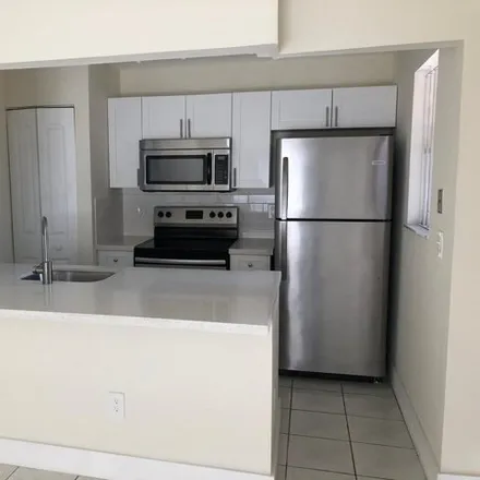 Rent this 3 bed condo on 6560 West 27th Court in Hialeah, FL 33016