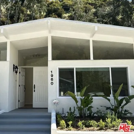 Rent this 4 bed house on 1960 North Beverly Drive in Beverly Hills, CA 90210