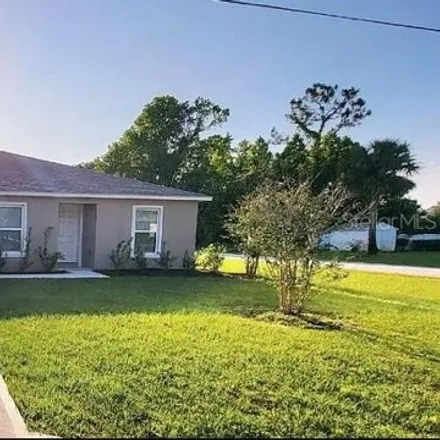 Rent this 4 bed house on Rolling Fern Drive in Palm Coast, FL 32164