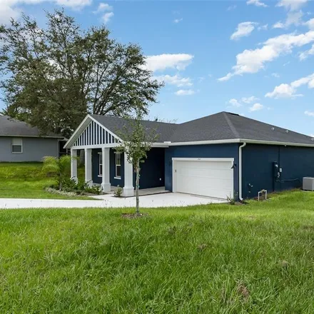 Buy this 4 bed house on 102 Hidden Oaks Drive in Lady Lake, FL 32159