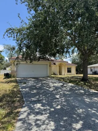 Buy this 4 bed house on 1945 Southwest Aladdin Street in Port Saint Lucie, FL 34953