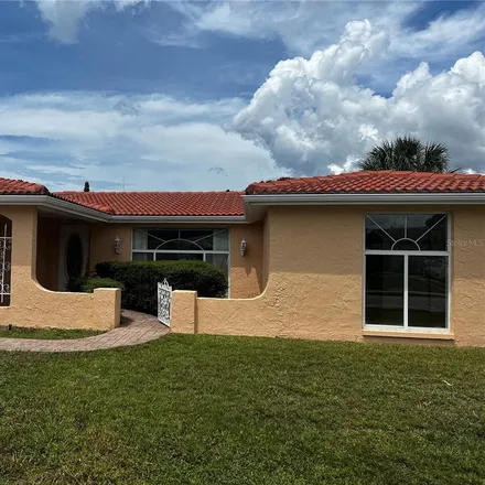 Rent this 2 bed house on 7213 Castanea Drive in Jasmine Estates, FL 34668