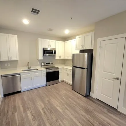 Rent this 2 bed apartment on 1720 Crestdale Dr Unit 1310 in Houston, Texas