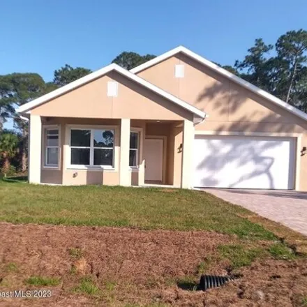 Rent this 3 bed house on 1066 Utah Street Southeast in Palm Bay, FL 32909