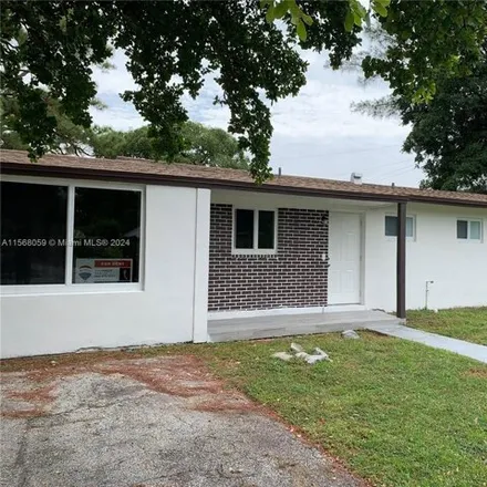 Rent this 4 bed house on 3298 Northwest 5th Court in Browardale, Lauderhill