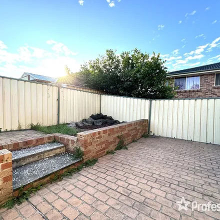 Rent this 3 bed townhouse on 130 Glenfield Road in Casula NSW 2170, Australia