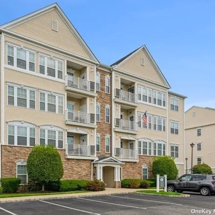 Buy this 2 bed condo on Saxton Street in East Patchogue, NY 11772