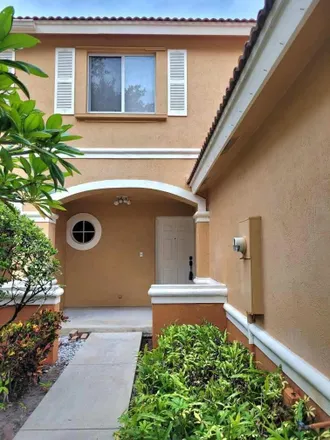 Rent this 3 bed townhouse on 6098 Eaton Street in West Palm Beach, FL 33411