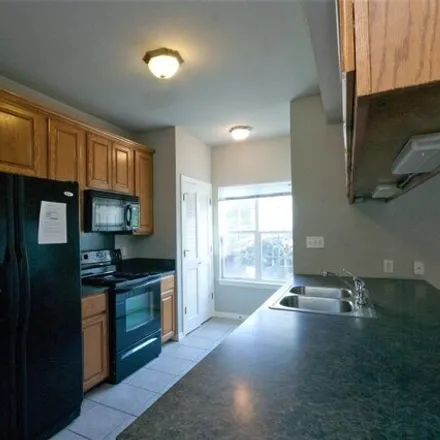 Rent this 4 bed apartment on 1105 West 25th Street in Austin, TX 78799