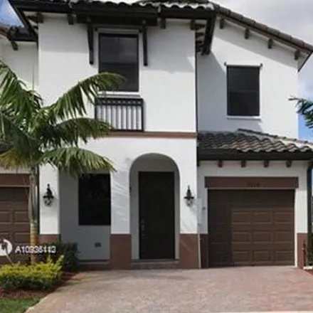 Rent this 4 bed townhouse on 8878 NW 103rd Ave