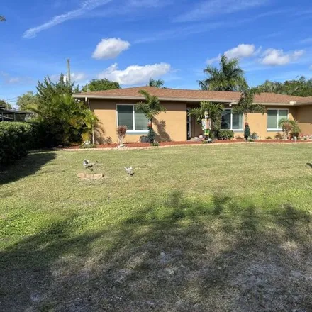 Buy this 4 bed house on 721 Southeast White Avenue in Port Saint Lucie, FL 34983
