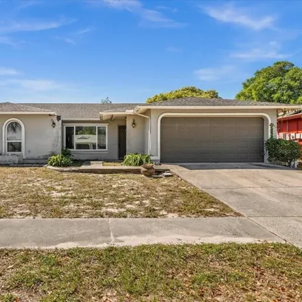 Buy this 4 bed house on 8790 Wolf Den Trail in Bayonet Point, FL 34668