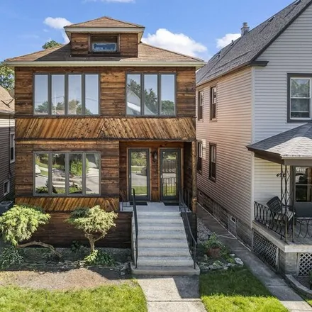 Buy this 4 bed house on 4915 W Grace St in Chicago, Illinois