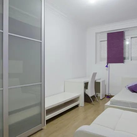 Rent this 4 bed room on Rua João do Nascimento Costa 12 in 1900-269 Lisbon, Portugal