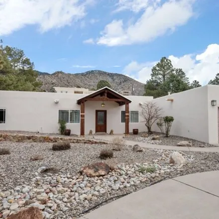 Buy this 4 bed house on 13230 Sunset Canyon Drive Northeast in Glenwood Hills, Albuquerque