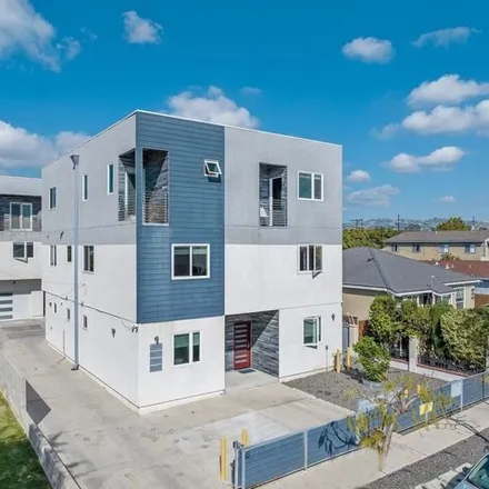 Rent this 4 bed townhouse on 1869 South Curson Avenue in Los Angeles, CA 90019