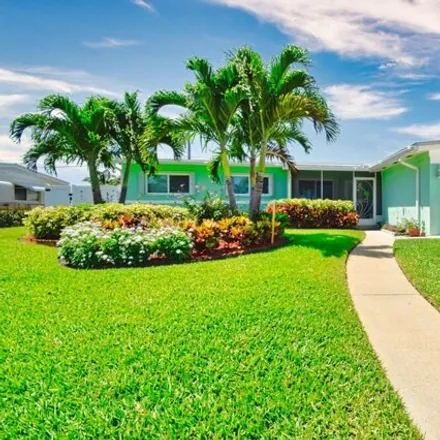 Buy this 4 bed house on Flamingo Way in North Palm Beach, FL 33408