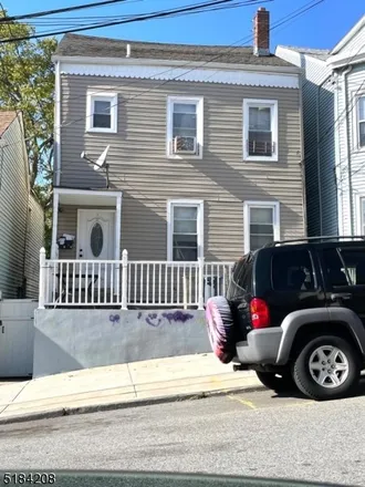 Buy this 5 bed townhouse on 15 North 6th Street in Paterson, NJ 07522