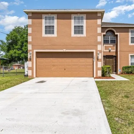 Buy this 4 bed house on 1393 Sagola Street Southeast in Palm Bay, FL 32909