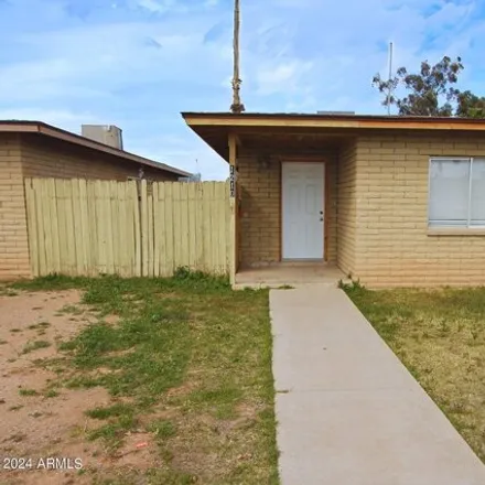 Rent this 3 bed house on 1212 East 11th Place in Casa Grande, AZ 85122