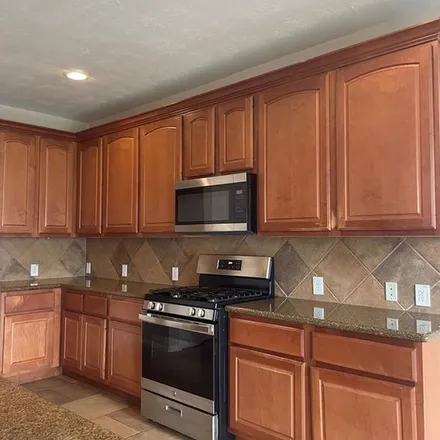 Rent this 4 bed apartment on 6412 Stone Landing Lane in Harris County, TX 77449