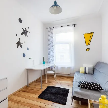 Rent this 8 bed apartment on Feliksa Nowowiejskiego 6 in 61-731 Poznań, Poland