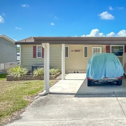 Buy this studio apartment on 104 Pine Drive in Lady Lake, FL 32159