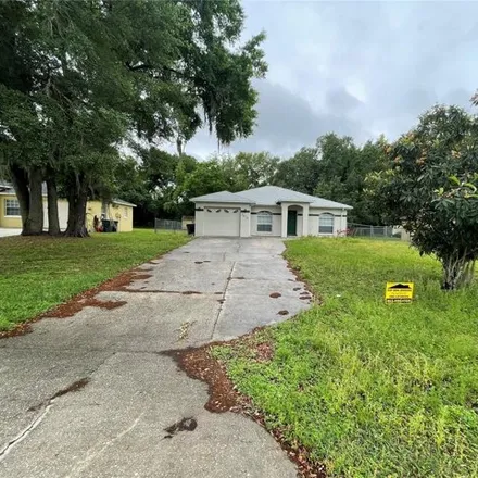 Rent this 4 bed house on 3706 Country Lane in Polk County, FL 33810