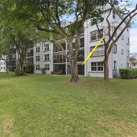 Buy this 2 bed condo on Royal Park Drive in Royal Palm Isles, Broward County