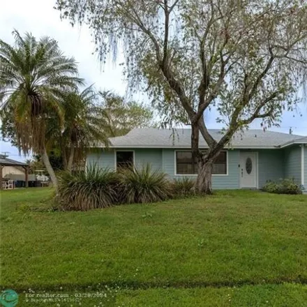 Buy this 3 bed house on 860 Southwest Curry Street in Port Saint Lucie, FL 34983