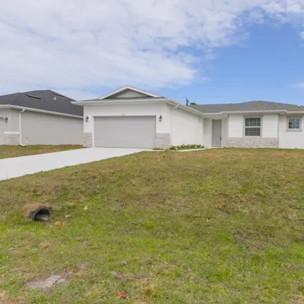 Rent this 4 bed house on 1501 Wacker Avenue Southeast in Palm Bay, FL 32909