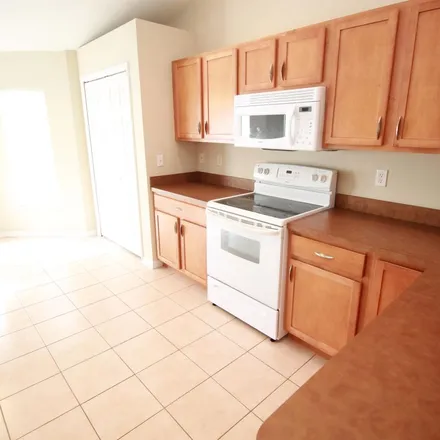 Rent this 3 bed apartment on 928 Southwest Hamberland Avenue in Port Saint Lucie, FL 34953