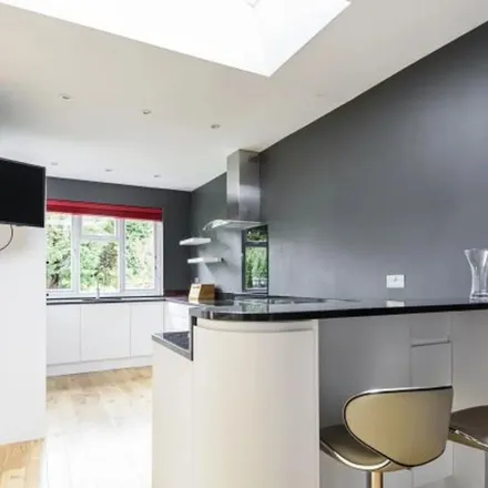 Rent this 3 bed apartment on 18 Holland Avenue in London, SW20 0RN