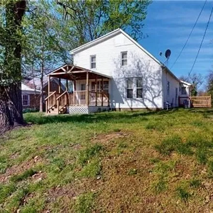 Buy this 3 bed house on 1058 South Main Street in Nevada, MO 64772