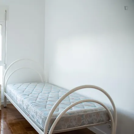 Rent this 4 bed room on Avenida de Berlim 83 in 1800-111 Lisbon, Portugal