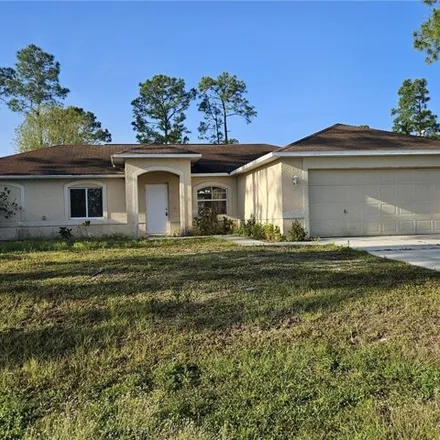 Rent this 4 bed house on 939 Dempsey Street in Lehigh Acres, FL 33974