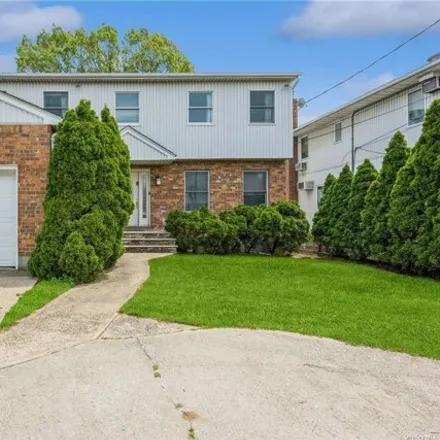 Buy this 4 bed house on 317 W Broadway in Cedarhurst, New York