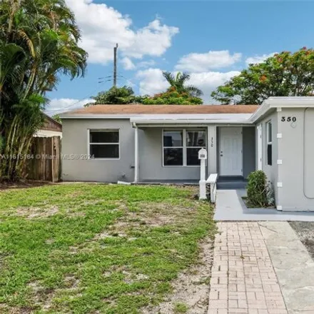 Buy this 3 bed house on 350 NE 56th St in Oakland Park, Florida