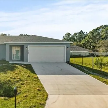 Buy this 3 bed house on 2776 Gainesville Road Southeast in Palm Bay, FL 32909