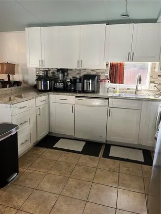 Buy this studio apartment on 13085 Southwest 9th Place in Davie, FL 33325