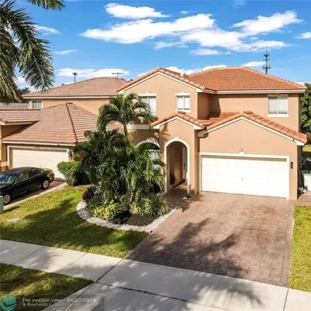 Buy this 4 bed house on 5133 Woodfield Way in Coconut Creek, FL 33073