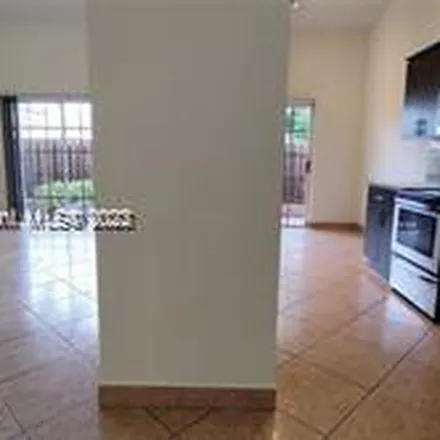 Rent this 3 bed apartment on 990 Northeast 212th Terrace in Miami-Dade County, FL 33179