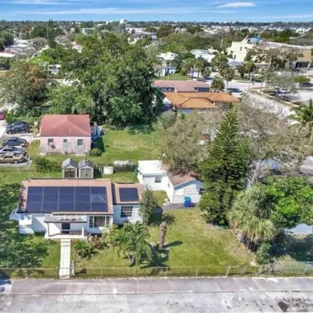 Buy this 5 bed house on 6000 Northwest 9th Avenue in Liberty Square, Miami