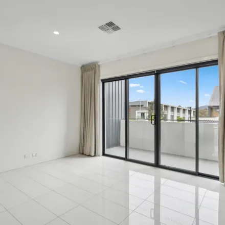 Rent this 3 bed townhouse on 23 Wanderlight Avenue in Lawson ACT 2617, Australia