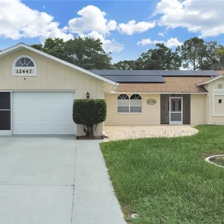 Buy this 3 bed house on 12447 Spreading Oak Drive in Spring Hill, FL 34609
