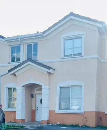 Rent this 4 bed townhouse on 7337 Northwest 174th Terrace in Miami-Dade County, FL 33015