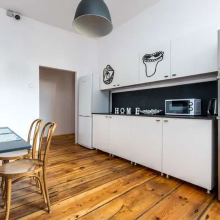 Rent this 7 bed apartment on Feliksa Nowowiejskiego 1 in 61-731 Poznan, Poland
