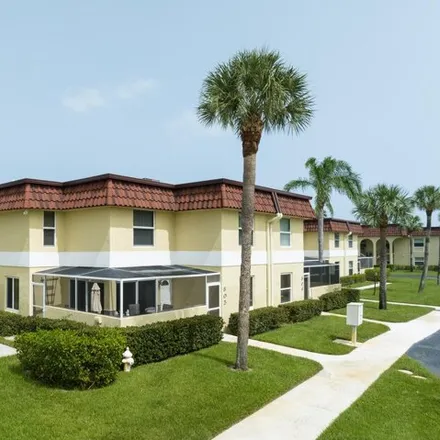 Buy this 2 bed townhouse on Villas on the Green in Jupiter, FL